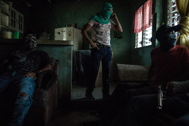 San Pedro Sula, Honduras, June 8th, 2017:Members of a local street gang gather inside their safehouse in a poor neighborhood in San Pedro Sula. Enemies of the two main gangs, the Mara Salvatrucha (MS-13) and Barrio 18, their main activity is to protect their neighborhood while while doing narcomenudeo and working as hitmen.Gang violence, poverty and poor political and socio economical  conditions are still driving large numbers of Hondurans to seek asylum in the United States, Latin America and Europe.Photo © Adriana Zehbrauskas